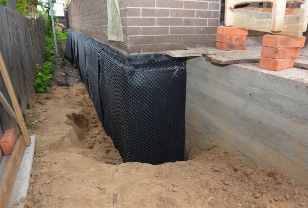 SJ Waterproofing Pros technician performing targeted Waterproofing assessment in Colts Neck, NJ